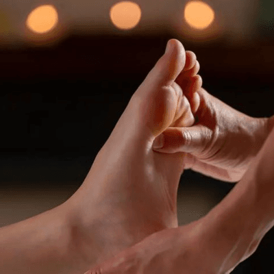 Foot reflexology by candlelight